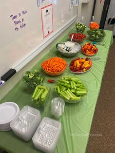 there are many different types of vegetables on the table and in bowls next to each other