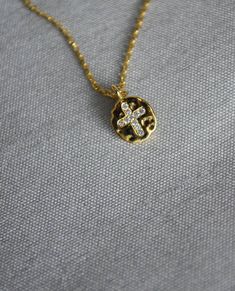 "This beautiful and dainty cross necklace would be a perfect gift for a Baptism, First Communion, Confirmation or for a godchild or godparent. The gold, silver or rose gold plated charm is approximately .25 inches and is hung on a 16\", 18\" or 20\" chain. Please add your chain length to the personalization section. If not added then we will include an 18\" chain. We also offer a 14K filled chain and a sterling silver chain in 16, 18 or 20 inches. The chains are dainty and very pretty - the perf Dainty Cross Necklace For First Communion, Dainty Cross Pendant Necklace For Baptism, White Cross Necklace For Baptism, Dainty Cross Necklace For Baptism, Elegant Cross Necklace For Confirmation, Personalized Dainty Cross Necklace, Cross Jewelry For Confirmation And Mother's Day, Cross Jewelry For Baptism And Mother's Day, Personalized Cross Pendant Necklace For First Communion