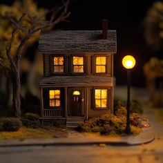 a doll house is lit up at night