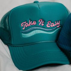 Searching for a relaxed and comfortable hat to take on your next adventure? Look no further than the Take It Easy Foam Trucker Hat! Perfect for the lake. The foam trucker hat is perfect for keeping you cool all day in hot weather. 65% cotton, 35% polyester machine wash delicate or hand wash one size fits most adjustable back mesh netting snapback closure Katydid Wholesale offers an unbeatable selection of wholesale hats and t-shirts for all occasions. Our wholesale hats feature over 1000 varieti Trendy Trucker Hat For Summer Outdoor Activities, Green Summer Trucker Hat For Outdoor Activities, Curved Bill Baseball Cap For Summer Camping, Summer Travel Trucker Hat, 5-panel, Sporty Summer Camping Hats, Fun Trucker Hat With Curved Bill For Outdoor, Summer 5-panel Trucker Hat For Camping, Snapback Trucker Hat For Travel, Green Sporty Trucker Hat For Summer