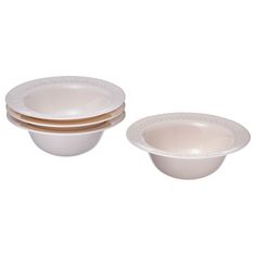 three white bowls with gold rims are stacked on top of each other in front of a white background