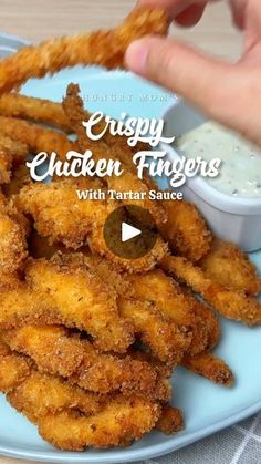 chicken fingers with tartar sauce being served on a blue plate for an advert