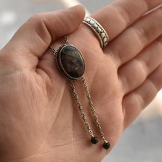 This design is a success in so many ways. We love the traditional western bolo tie, but we wanted a more feminine version of it. We've used traditional southwestern silversmithing using .925 twist wire accents -- oxidized, sanded and polished. This necklace closes in the back with a clasp like any necklace and uses an ultra-comfortable .925 Sterling Silver rope chain -- the sterling silver chain "tips" (hematite) are an added bonus, and really add a lot. An LBJ original! The Mock Bolo. features Ocean Jasper Necklace, Western Bolo Tie, Bolo Necklace, Silver Rope Chain, Stone Choker, Jasper Necklace, Fossil Coral, Twisted Wire, Bolo Tie