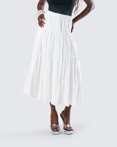 You’ll always be top tier in this white tiered maxi skirt 👑 Made from viscose challis fabric and featuring an elastic waistband and A-line design - this piece is the perfect closet staple to pair with everything 🤍 Spring Relaxed Fit Tiered Maxi Dress, Chic Tiered Maxi Skirt With Layered Hem, Summer Rayon Tiered Maxi Dress, Summer Tiered Maxi Dress In Rayon, Beach Tiered Maxi Skirt, Flowy Ruffled Rayon Maxi Skirt, White Tiered Skirt Maxi Dress For Vacation, Beach Tiered Ruffled Maxi Skirt, Flowy Rayon Maxi Skirt With Ruffles