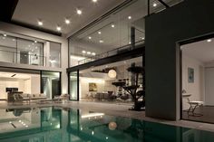 an indoor swimming pool in the middle of a house