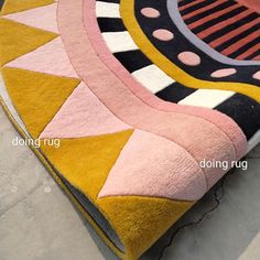 a colorful rug is laying on the floor