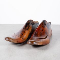 ABOUT  Price is per pair. Decorative only. Sizes unknown. Please specify which pair you would like?   Original pairs of cobbler's wooden shoe lasts. Refinished and shellacked.      CREATOR Unknown.     DATE OF MANUFACTURE c.1920     MATERIALS AND TECHNIQUES Maple or Beech.      CONDITION Good. Wear consistent with age and use.     DIMENSIONS H 4 in. W 11.75 in. D 4 in.  HISTORY This pair was salvaged from a cobbler's shop in the Mission District of San Francisco. The shop was open from the 1920 Heal Shoe, Mission District, Wooden Shoe, Wood Shoes, Shoe Last, Wooden Shoes, The Mission, Cobbler, San Francisco