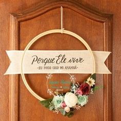 a wooden door with a sign that says porque el rire and flowers on it