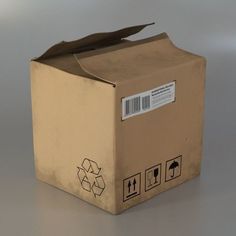 an open cardboard box with some stickers on the side and a barcode label