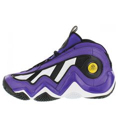 a purple and black basketball shoe on a white background