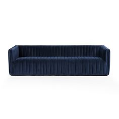 a blue velvet sofa on a white background