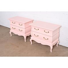 two pink dressers sitting next to each other