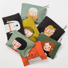 four small pouches with different designs on them