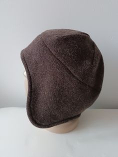 a brown hat sitting on top of a white mannequin head