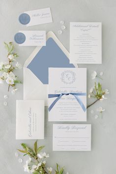 the wedding stationery is laid out and ready for guests to arrive