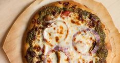 a pizza sitting on top of a wooden cutting board