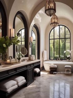 a large bathroom with arched windows and an oval tub