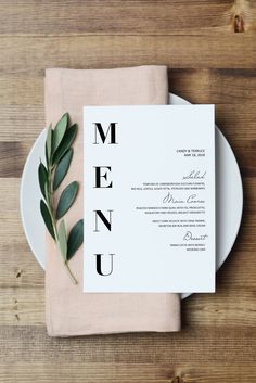 a plate with a menu on top of it next to a fork and knife in front of a napkin