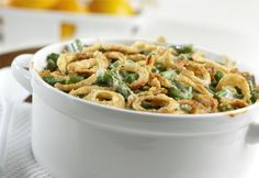 an image of a website page for green bean casserole with onion rings in it