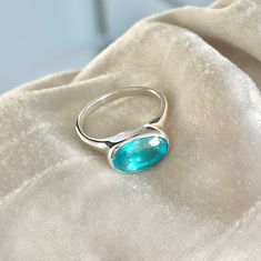 Hand carved in wax first with the stone of your choice either faceted oval paraiba apatite or oval cabochon Bigger stones are available on pre order Oval Turquoise Topaz Ring, Modern Oval Turquoise Ring As Gift, Oval Turquoise Birthstone Ring, Modern Oval Emerald Birthstone Ring, Modern Oval Turquoise Gemstone Ring, Oval Turquoise Topaz Ring As Gift, Oval Turquoise Sapphire Ring As A Gift, Turquoise Oval Topaz Ring, Oval Turquoise Moonstone Ring