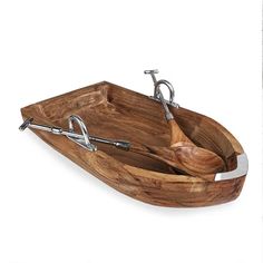 a wooden boat shaped tray with two handles on the bottom and one handle in the middle