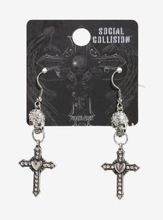 Channel some of that goth energy with these drop earrings decorated with rhinestone skulls holding rings in their mouths. Hanging from the rings are ornate  bedazzled gothic crosses with hearts in their centers.Nickel-free alloy; glass; plasticImported Right Arrow Icon, Rhinestone Skull, Location Icon, Gothic Crosses, Detailed Jewelry, Accessories Jewelry Earrings, The Rings, Hot Topic, Fashion Earrings