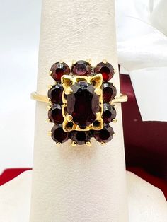 18K Yellow Gold Garnet Ring Size 7 A perfect gift for your loved one for any special occasion or holiday! Total Ring Weight: 4.14g Ring Length: 26.49mm Ring Width: 19.48mm Gemstone: Garnet Item will be placed into a gift box. * Heirloom Cluster Ring Gift, Gold Garnet Cluster Ring As Gift, Cluster Ruby Ring In 14k Gold As Gift, 14k Gold Cluster Ruby Ring For Gift, 14k Gold Cluster Ruby Ring As Gift, Collectible Cluster Gemstone Rings, Yellow Gold Garnet Cluster Ring As Gift, Oval Cluster Ring With 17 Jewels As Gift, Antique Cluster Ring As A Gift