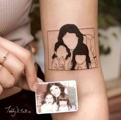 a woman's arm with a family photo on it