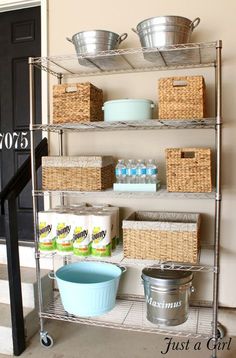 the shelves are organized with baskets, containers and other items to keep things fresh in