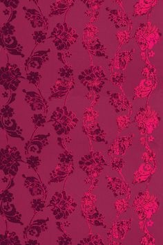 a red and black wallpaper with flowers on it