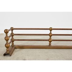 an antique wooden bench with four posts