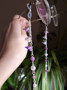 Introducing a glasses chain inspired by the enchanting wisteria flowers. This delicate piece features intricate flower beads, complemented by soothing lepidolite beads and imitation pearls. Designed to add a touch of femininity to your eyewear, this chain is as elegant as it is functional. Elevate your accessory game with this enchanting wisteria-inspired glasses chain. This eyeglass chain might be slightly heavier than regular chains because of some stone beads and crystals. Actual colors of an Purple Fairycore Jewelry For Party, Whimsical Purple Beaded Jewelry, Purple Glass Beaded Chain Jewelry, Purple Glass Glasses Chains As Gift, Adjustable Purple Glass Glasses Chains, Fairy Glasses, Fantasy Glasses, Grunge Necklaces, Chains Aesthetic