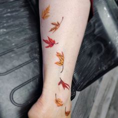 a woman's foot with leaves on it