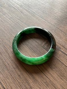 "🌈 Jade Bangle 59.7mm (2.35\"), Round Shape, Green & Light Green 🌷 Untreated Natural Jadeite/ Grade A Jade 🌷 Certification : Yes 🌷 Jade from Myanmar/ Burma 🌷 Shape : Round 🌷 Inner diameter : 59.7mm / 2.35\" 🌷 Width & Thickness : 14.2 x 8.8mm 🌷 Color : Green & Light Green 🌷 Free standard shipping from Hong Kong with tracking included 🌷 Take approximately 7-21 days to arrive worldwide ❤️ In Chinese Culture: Young people wear jade pendant will have a prosperous life, attracts Green Carved Round Bangle, Carved Jade Round Bracelets, Carved Jade Bracelets, Handmade Round Jade Bangle, Green Carved Bangle Bracelet, Green Carved Bangle Bracelets, Carved Jade Bangle Bracelet, Carved Jade Bracelet, Jade Gemstone Bangle Bracelet