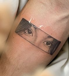 a woman's arm with an eye on it