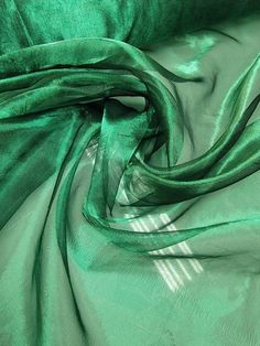 the green fabric is very soft and shiny