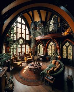 a living room filled with lots of furniture and large arched windows on the side of it