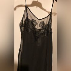 Medium Spaghetti Straps 29” Long Polyester Black Lace Trim Camisole Slip Dress, Black Camisole Slip Dress With Lace Trim, Sheer Cami Tank Top For Night Out, Evening Cami Tank Top With Lace Trim, Evening Lace Cami Tank Top, Delicate Straps Camisole For Night Out, Evening Lace Trim Camisole Tank Top, Sheer Fitted Camisole For Evening, Fitted Sheer Camisole For Evening