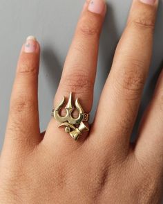 Om Shiv Trishul Ring, Brass Ring, Ohm Ring, Dainty Ring, Handmade Ring, Yoga Ring, Meditation Ring, Men's Ring, Gift For Her Size :- All Size Are Available METAL :- Brass ❥ Customers satisfaction is our biggest priority, please contact us with any questions/queries for future or existing orders, and we will do our best to make sure you are happy with your order. ♥ Please Make Sure to Include The Correct Address During Before Order. You Can return Item within 30 Days After Successful Delivery. We Offer 100% Money Back Guarantee If You Not Satisfied With Your Purchase. Return Charge Will Be Paid By Buyer Only. This is my shop link https://www.etsy.com/in-en/shop/AustereGifts?ref=seller-platform-mcnav Thank you🥰 for shopping with us! Balaji Rings For Men, Om Rings For Men, Shiv Trishul, Ohm Ring, Jewellery Making Tools, Yoga Ring, Mens Ring Designs, Hand Chain Jewelry, Gold Earrings For Men