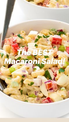 the best macaroni salad is in a white bowl with a fork on it