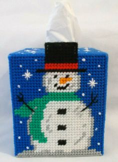 a tissue dispenser with a snowman on it