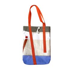 a white and blue tote bag with an orange ribbon hanging from the front, on a white background