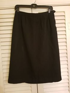 "++ HARRODS CALIFORNIA SKIRT ++ Vintage 60's skirt Basic black Front and back darts at the waist Fully lined Side zipper closure - the button is missing Made of a thicker knit material No size tags - would best fit a size M/L In great, gently used condition - the back hem may need sewn ✂ - - - Measurements laid flat: waist : 13\" hips : 20\" top to bottom: 26\" Let's be friends! Instagram @TheGirlSaidYes @COVET.Vintage https://www.facebook.com/TheGirlSaidYesVintage" Black Vintage Knee-length Bottoms, 60's Skirt, Vintage Black Skirted Bottoms, Black A-line Retro Skirt, Black Knee-length Cotton Skirt, Vintage Black Skirt With Buttons, Teacher Costume, 60s Skirt, 1960s Skirt