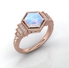 a ring with an opal stone surrounded by small diamonds on the side and sides