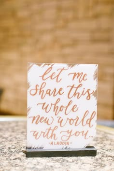 a card that says, let me share this whole world with you on the table