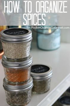 jars filled with spices sitting on top of a counter