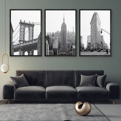 three black and white pictures hang on the wall above a couch in a living room