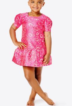 Your mini will delight in dressing up when she wears our festive Erina Dress. Made from golden floral brocade, this drop waist dress is finished with puff sIeeves.  ﻿﻿Short, poof sleeve, drop waist dress with a scooped neckline and back zipper. ﻿﻿Enjoy an extra 3/4" of hem flexibility with this style. Wear as-is or let it out for some extra length. ﻿﻿Gold Puff Floral Brocade (63% Polyester, 20% Metallic, 17% Nylon). ﻿﻿Hand wash cold, separately, or dry clean. ﻿﻿Imported. Elegant Spring Holiday Dress For Pageant, Elegant Pink Fitted Holiday Dress, Pink Dresses With Ruffle Hem And Fitted Bodice, Fitted Dress For Spring Pageant, Fitted Spring Dress For Pageants, Short Sleeve Dress With Fitted Bodice For Dress-up, Dresses With Fitted Bodice And Short Sleeves For Dress-up, Pink Princess Holiday Dress For Spring, Pink Fitted Princess Holiday Dress