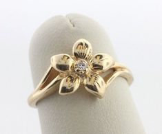 Manufacture 14K Yellow Gold (.585) Description Textured Orchid Flower Diamond Ring  Type Women's Jewelry Stone(s) None Total Weight 2.4 grams Specifications Ring Size 4.25 Ring Face Length: 0.40" Ring Face Width: 0.33" Shank Width: 2mm Flower Diamond Ring, Jewelry Stone, Orchid Flower, Gold Texture, Types Of Rings, Stone Jewelry, Women's Jewelry, Orchids, Diamond Ring