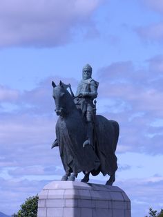 a statue of a man riding on the back of a horse